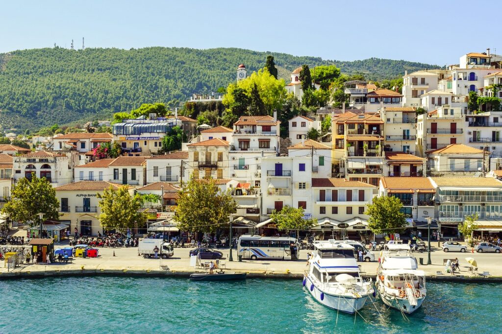 Skiathos' old port area: charming, bustling hub with picturesque views and vibrant nightlife.